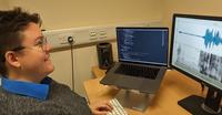 Emily Lindsay- Smith at work coding project